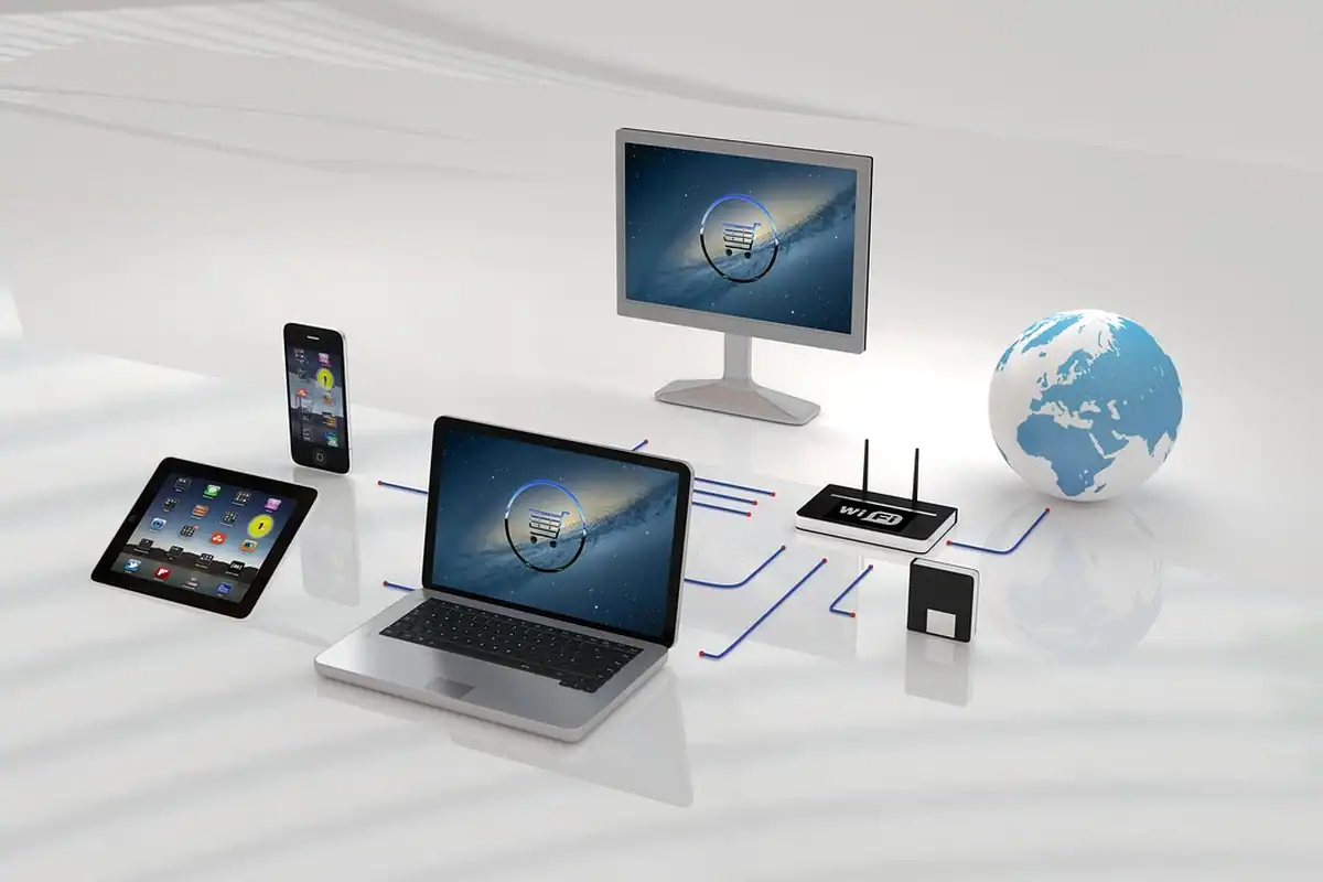 Schemă cu laptop, tabletă, telefon și monitor legate la un router și la globul pământesc